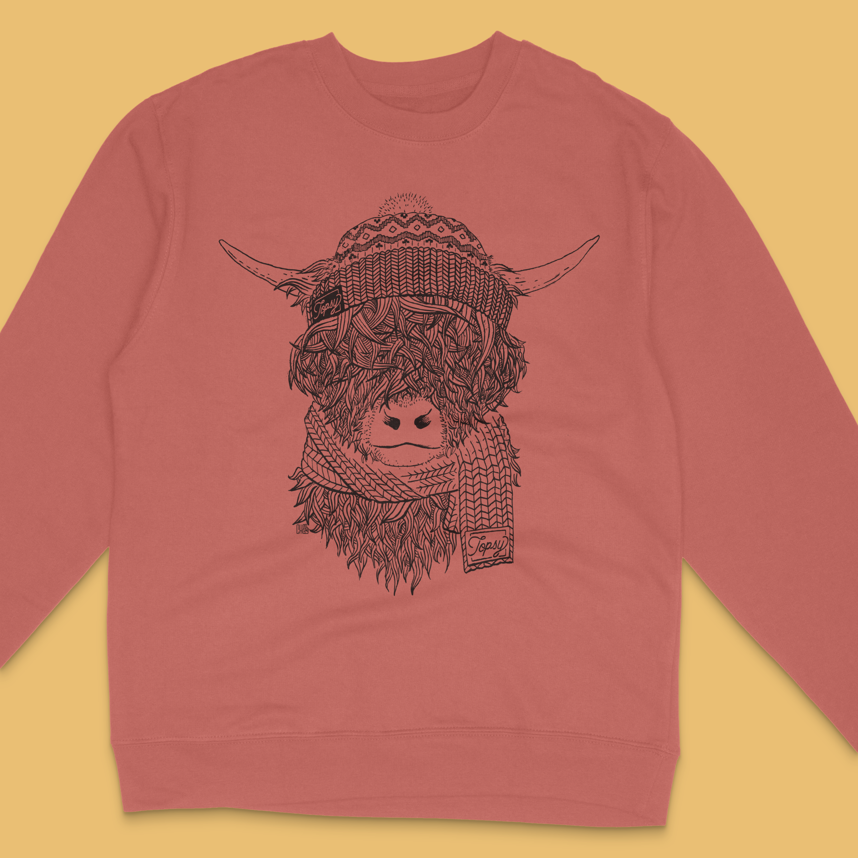 Topsy Farms' highland cow sweatshirt in clay red