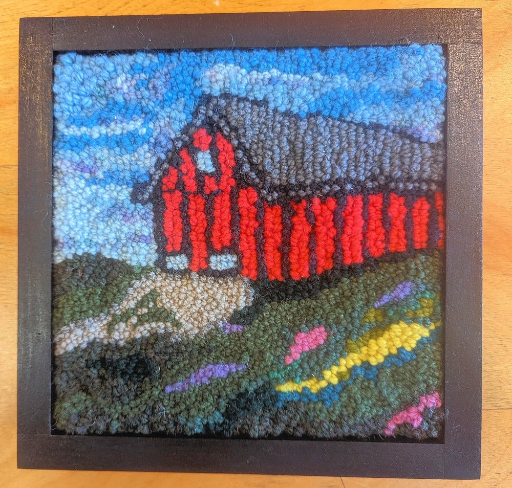Topsy Farms' handmade wool wall hanging of a red barn
