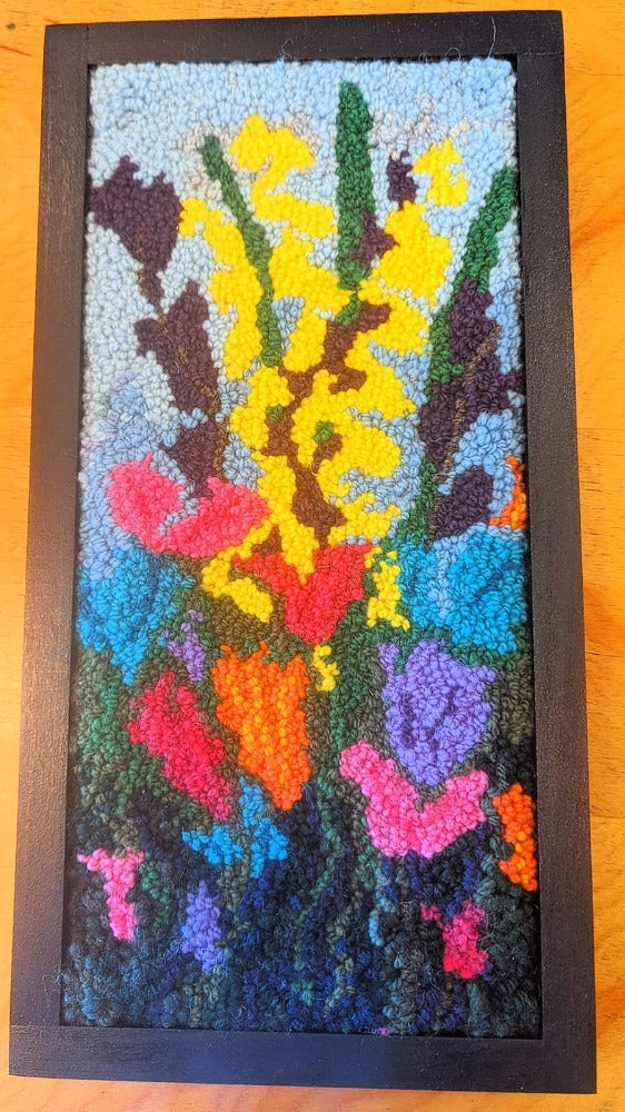 Topsy Farms' handmade wool wall hanging of colourful flowers