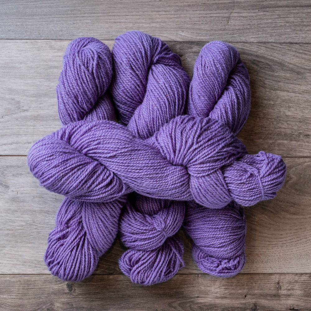 Mauve skeins of yarn.