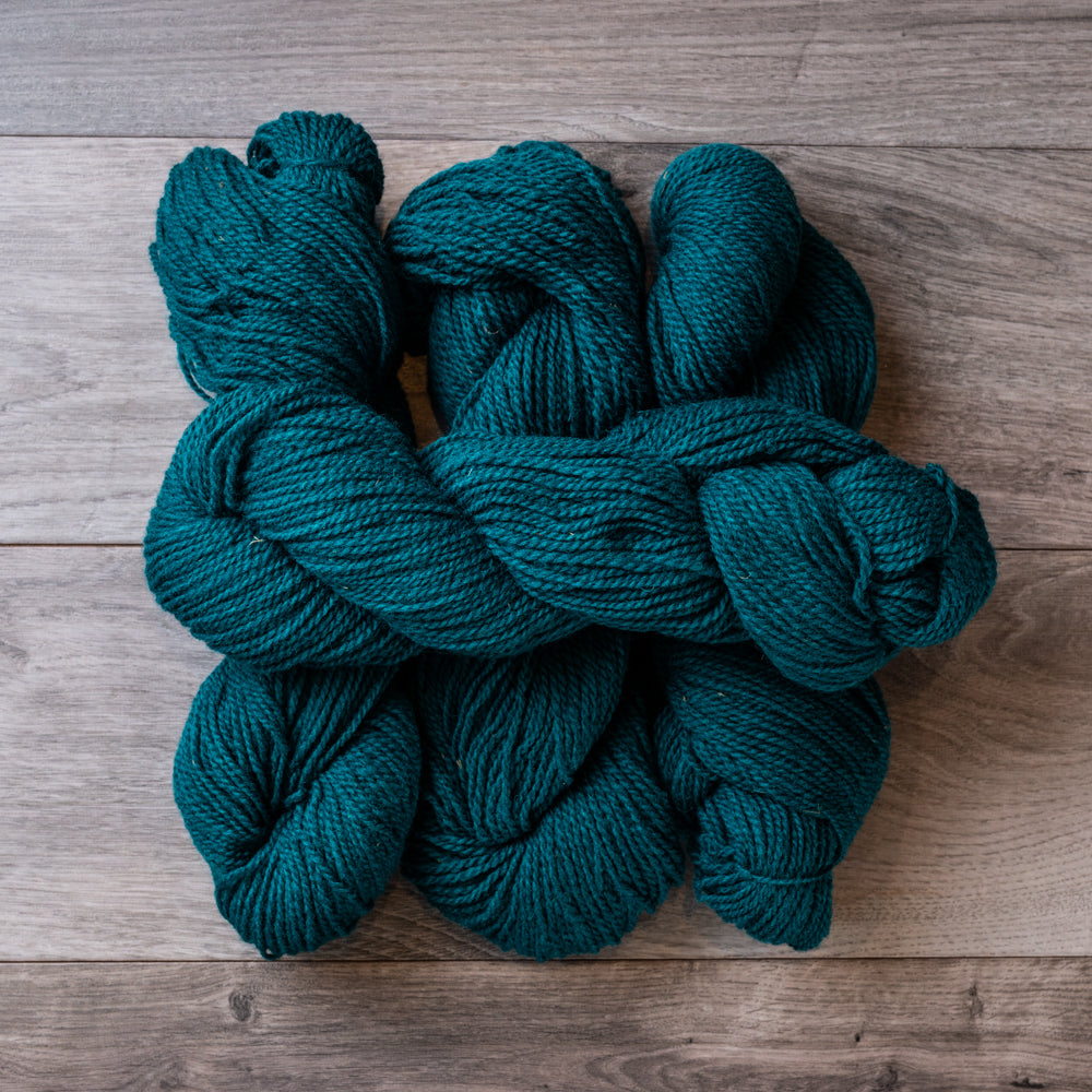 Teal skeins of yarn.