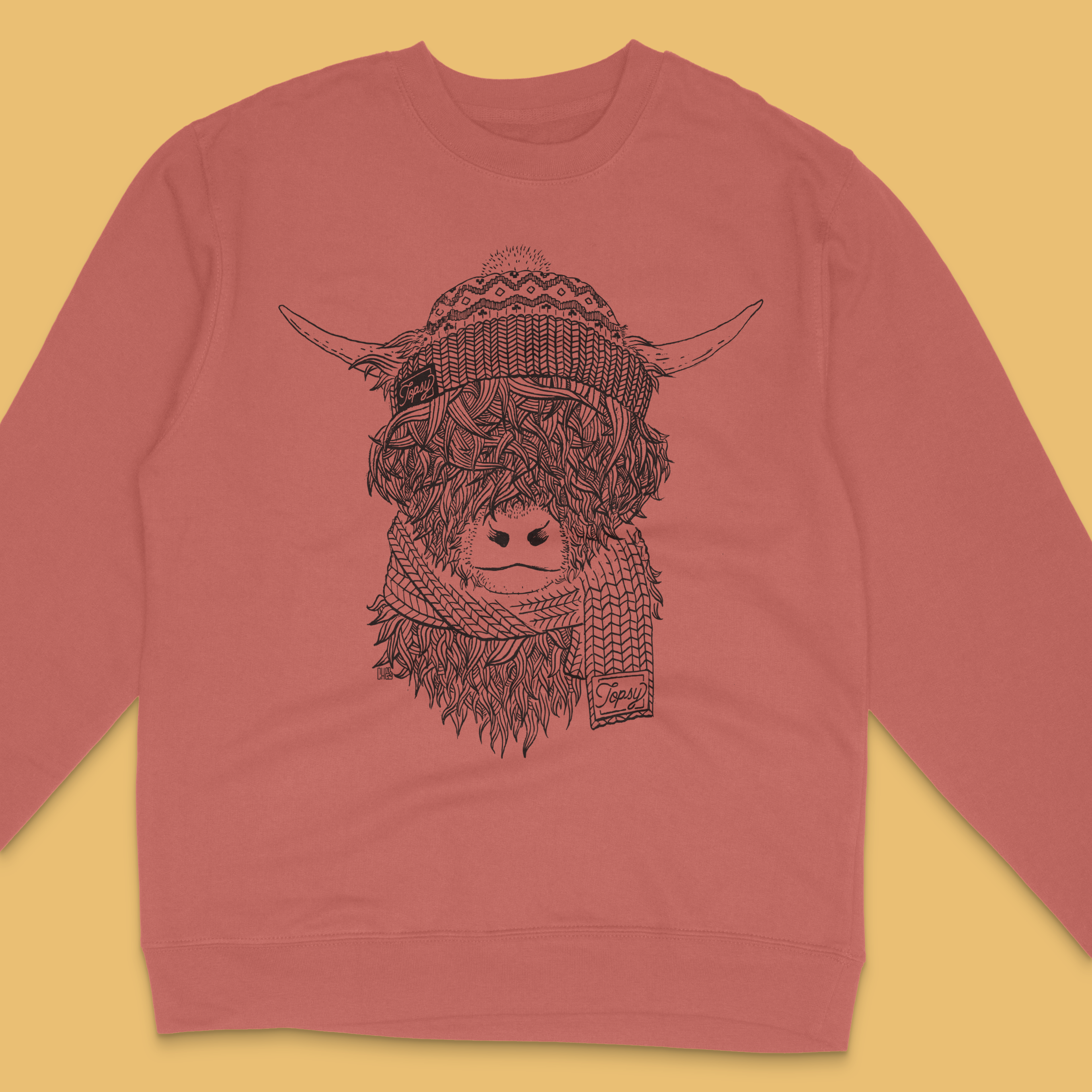 Topsy Farms' highland cow sweatshirt in clay red