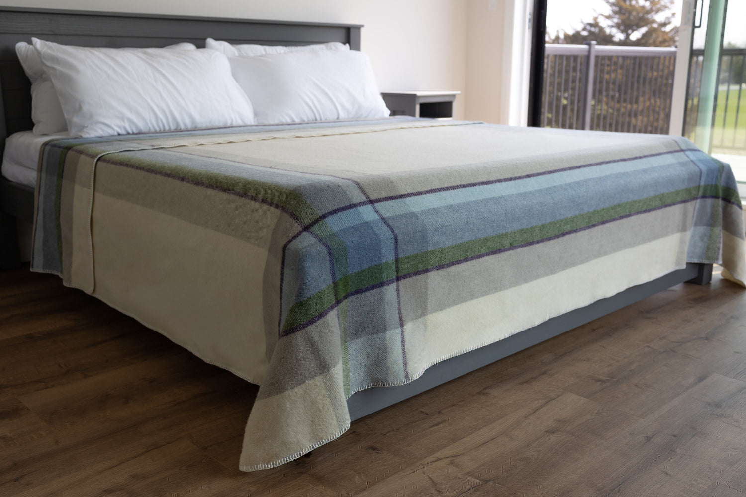 Topsy Farms' Shoreline Canadian wool blanket on a king bed