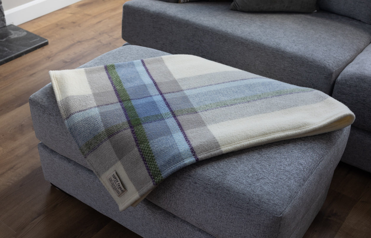 Topsy Farms' Shoreline Canadian wool throw on ottoman