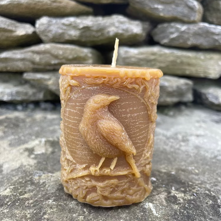 Topsy Farms' handmade beeswax pillar candle with birds and leaves