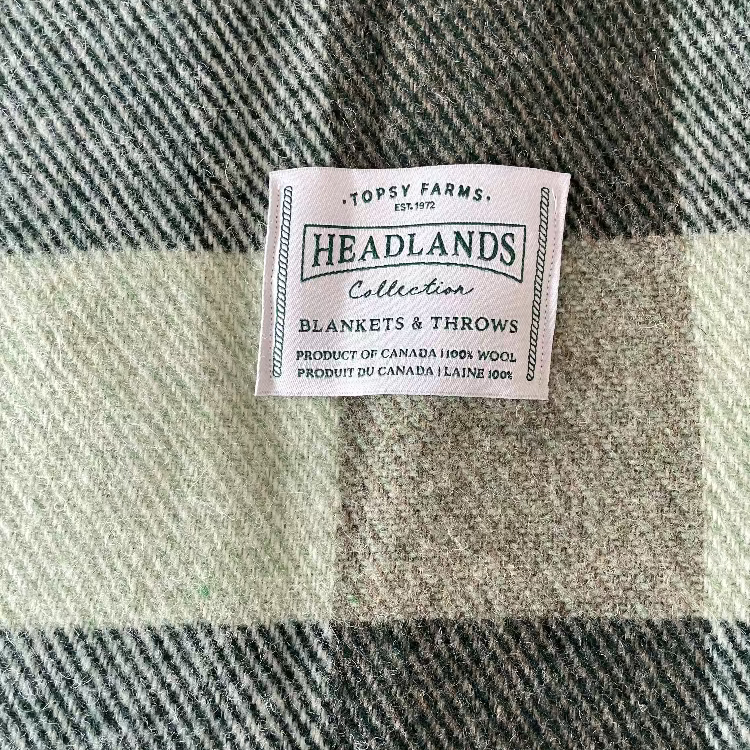Topsy Farms' Canadian wool forest and light green checkerboard blanket