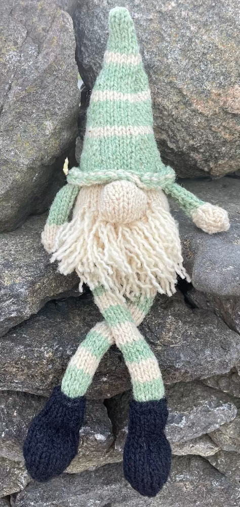 Topsy Farms' handmade wool shelf elf on stone wall