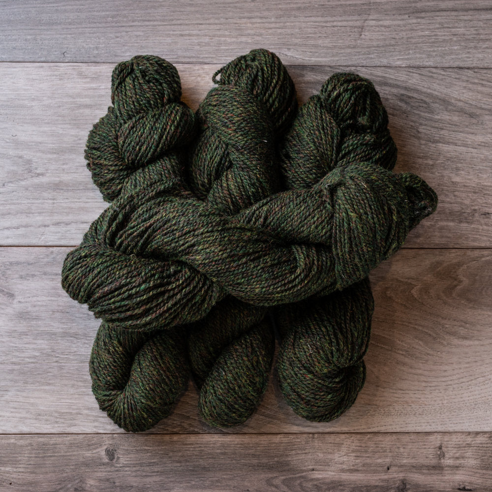 Topsy Farms' green heather wool yarn