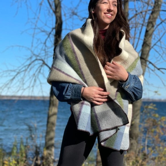 Woman with long brown hair standing by the lake in Topsy Farms' Shoreline patio wrap