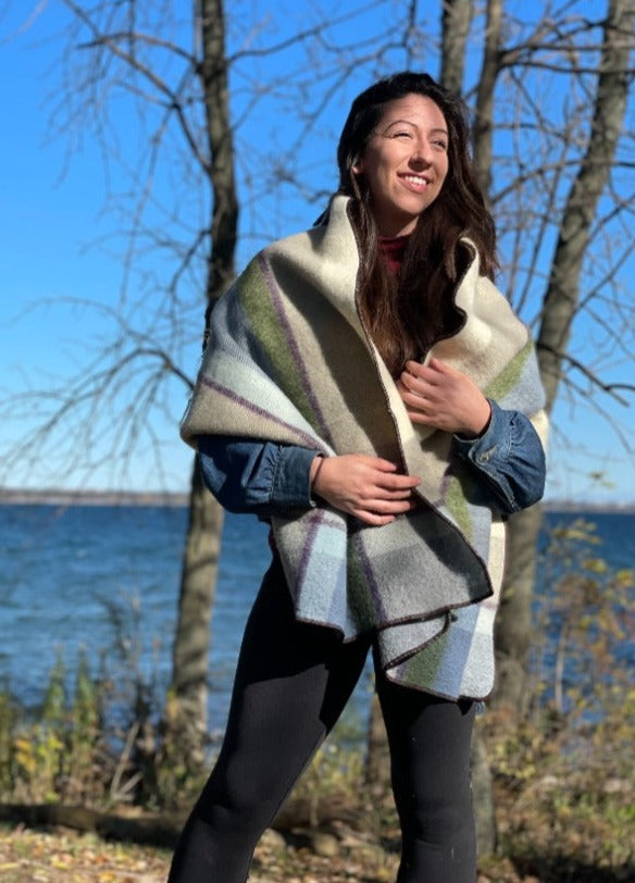Woman with long brown hair standing by the lake in Topsy Farms' Shoreline patio wrap