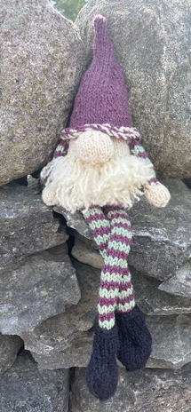 Topsy Farms' handmade wool shelf elf on stone wall