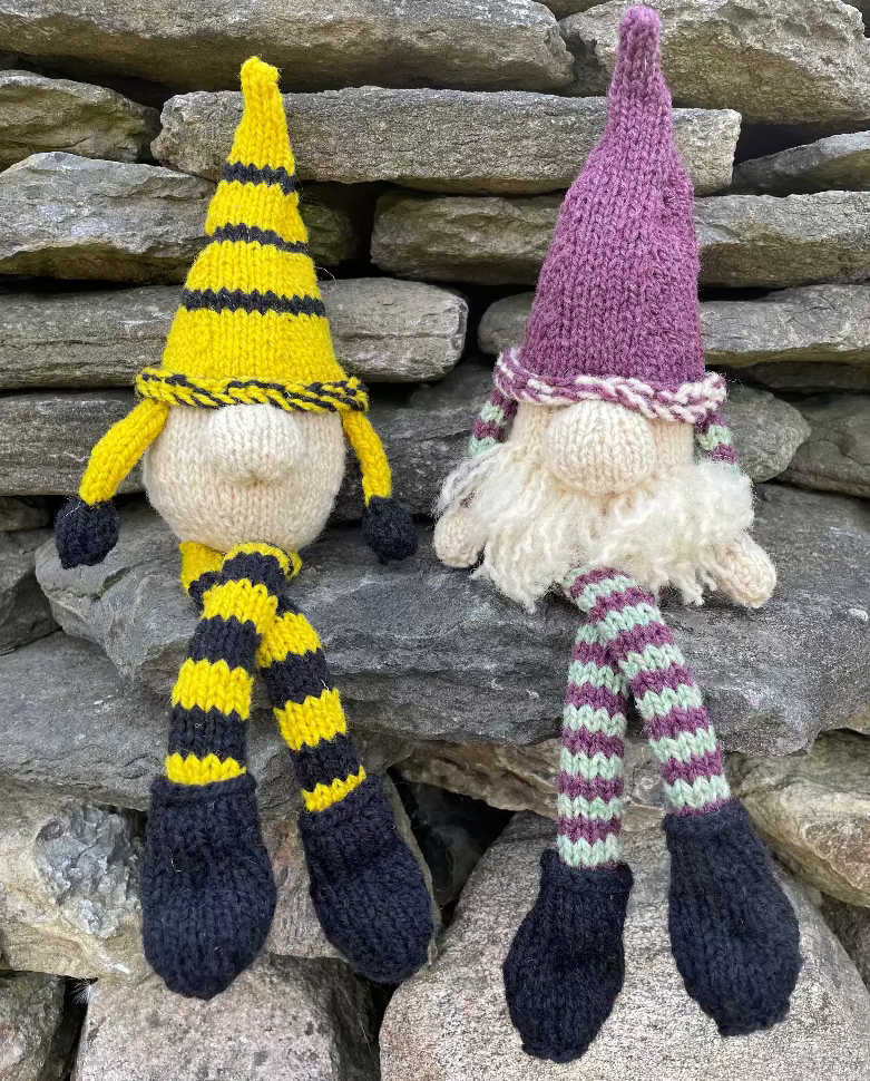 Topsy Farms' handmade wool shelf elves on a stone wall