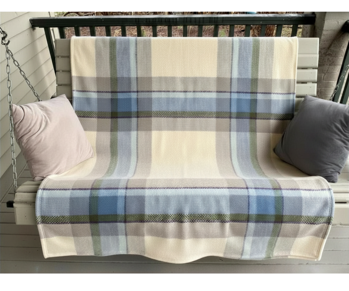 Topsy Farms' Shoreline Canadian wool blanket on a porch swing