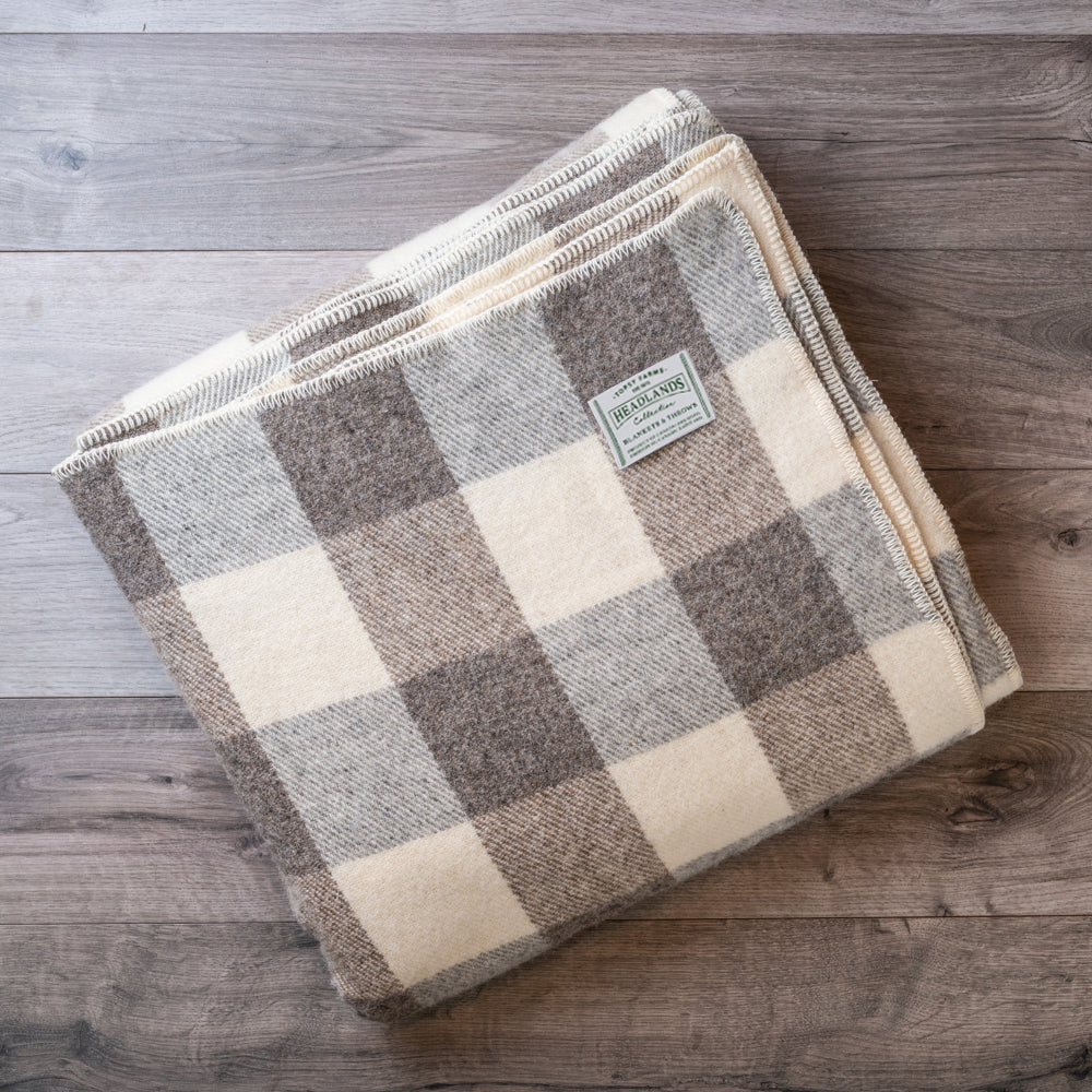 Topsy Farms' grey and white checkerboard wool blanket, folded