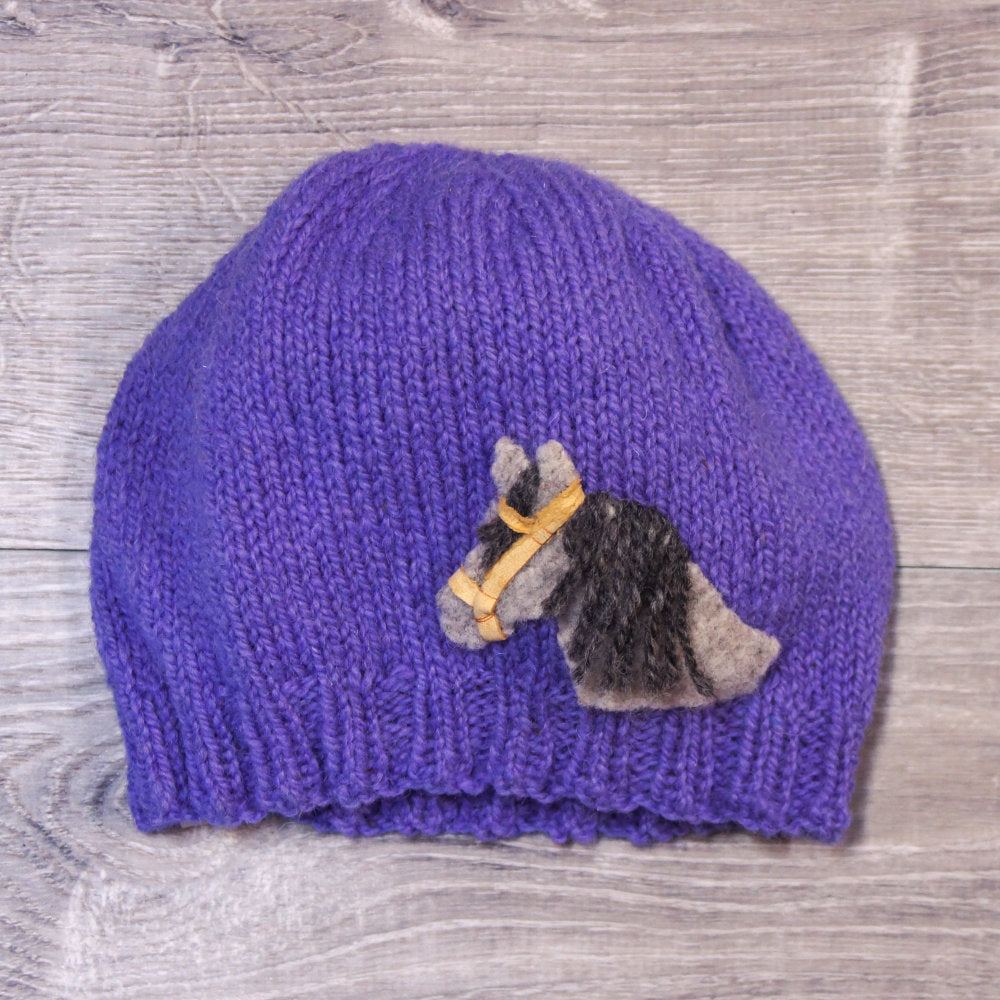 Purple knitted toque with felted horse attached. Made with Topsy Farms' wool