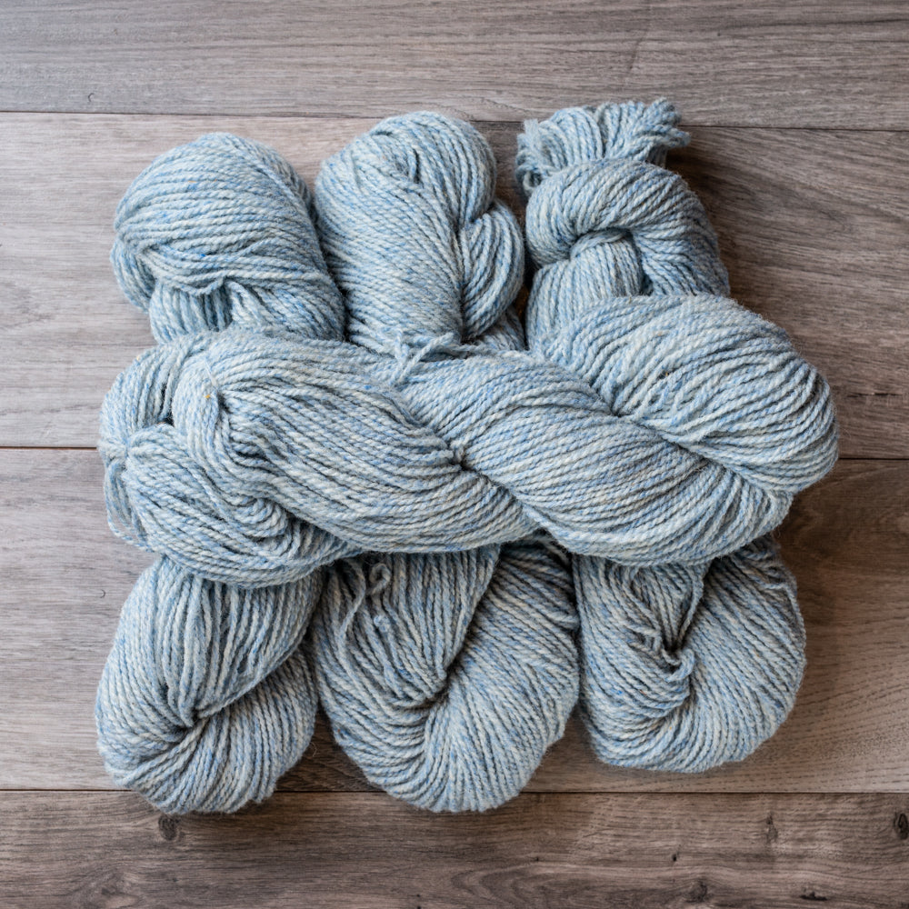 Blue Tweed skeins of yarn.