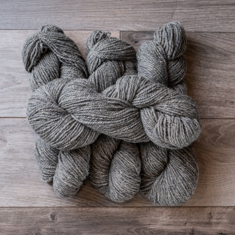 Dark Grey skeins of yarn.