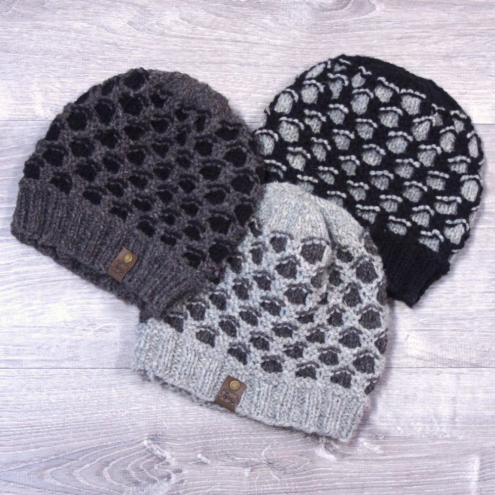 3 knitted wool hats in various shades of grey, made in a honeycomb pattern with Topsy Farms' wool