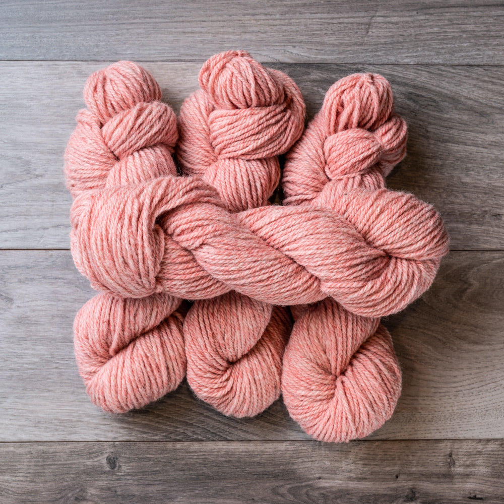 Pink Tweed skeins of yarn.