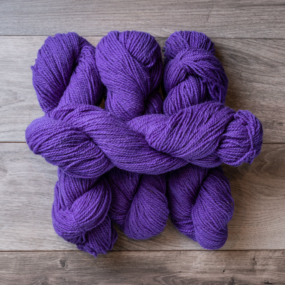 Purple skeins of yarn.