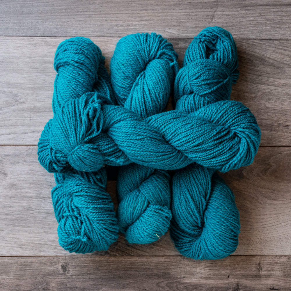 Turquoise skeins of yarn.